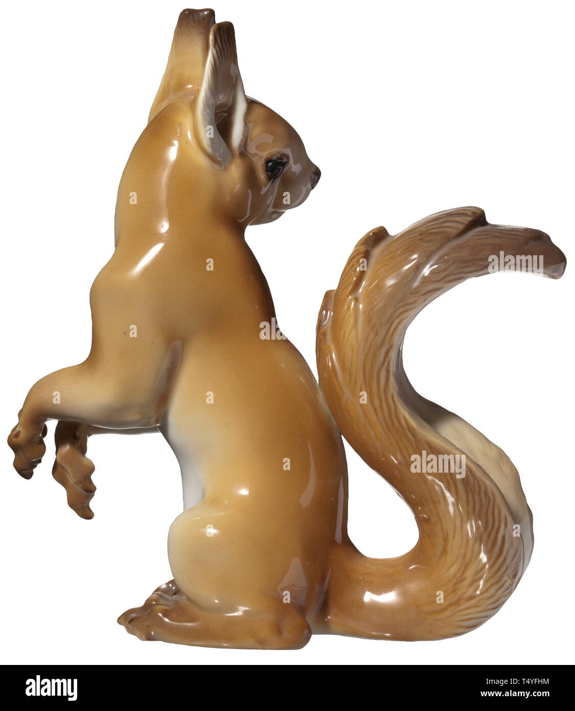 A squirrel. Coloured porcelain, in the bottom 'SS Allach' in green underglaze, impressed signature 'T. Kärner' and model number '68'. Height 15 cm. A rare figure in a completely, undamaged condition. historic, historical, porcelain, chinaware, 20th century, Editorial-Use-Only Stock Photo