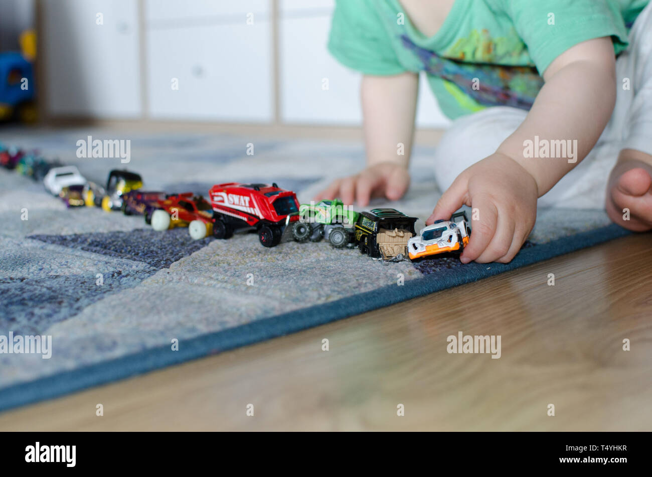 kids lining up toys
