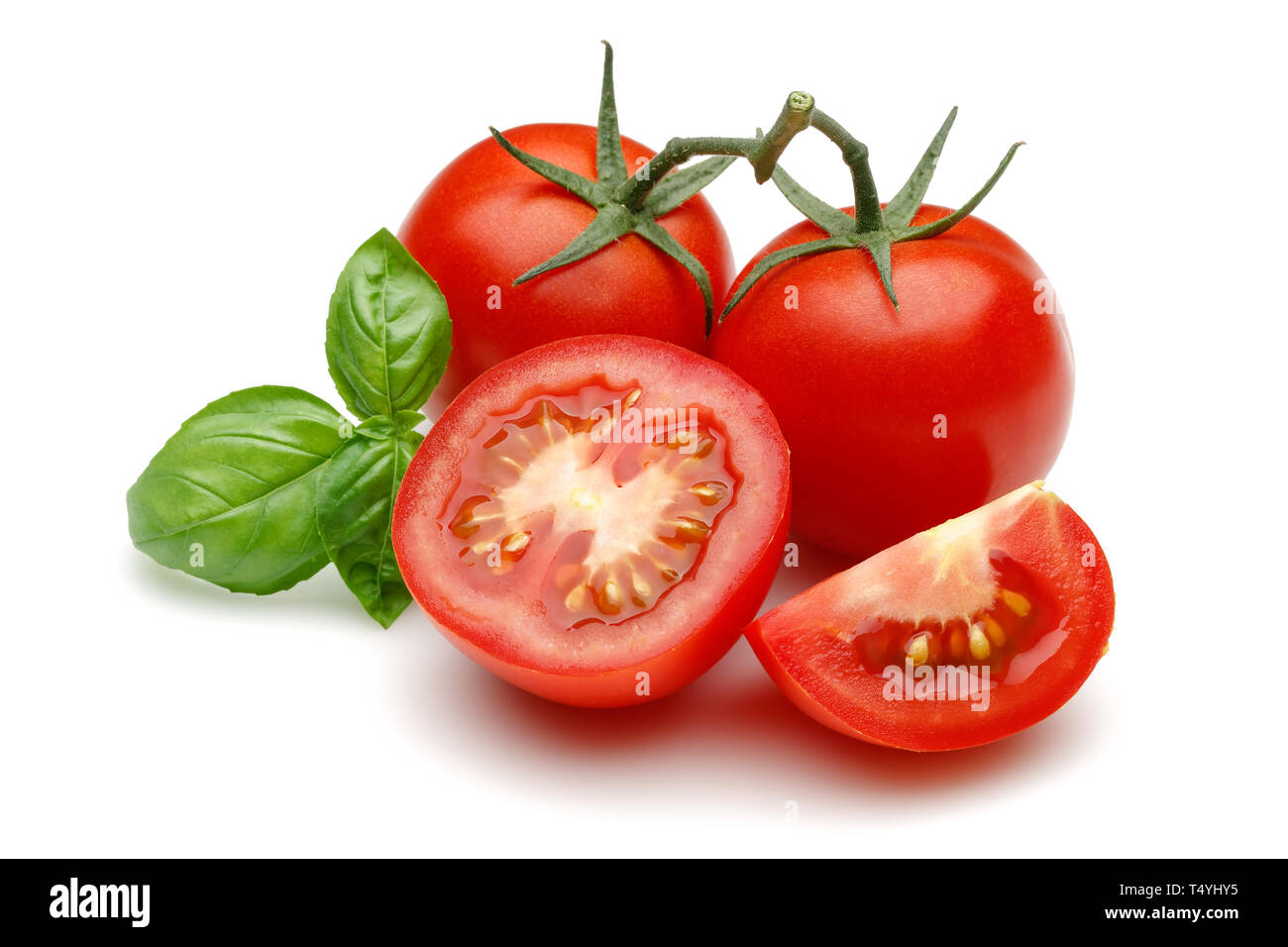 Fresh tomatoes and basil leaves isolated on white background Stock ...