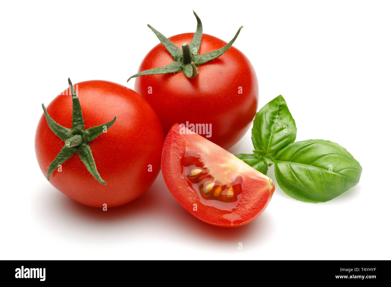 Fresh tomatoes and basil leaves isolated on white background Stock ...