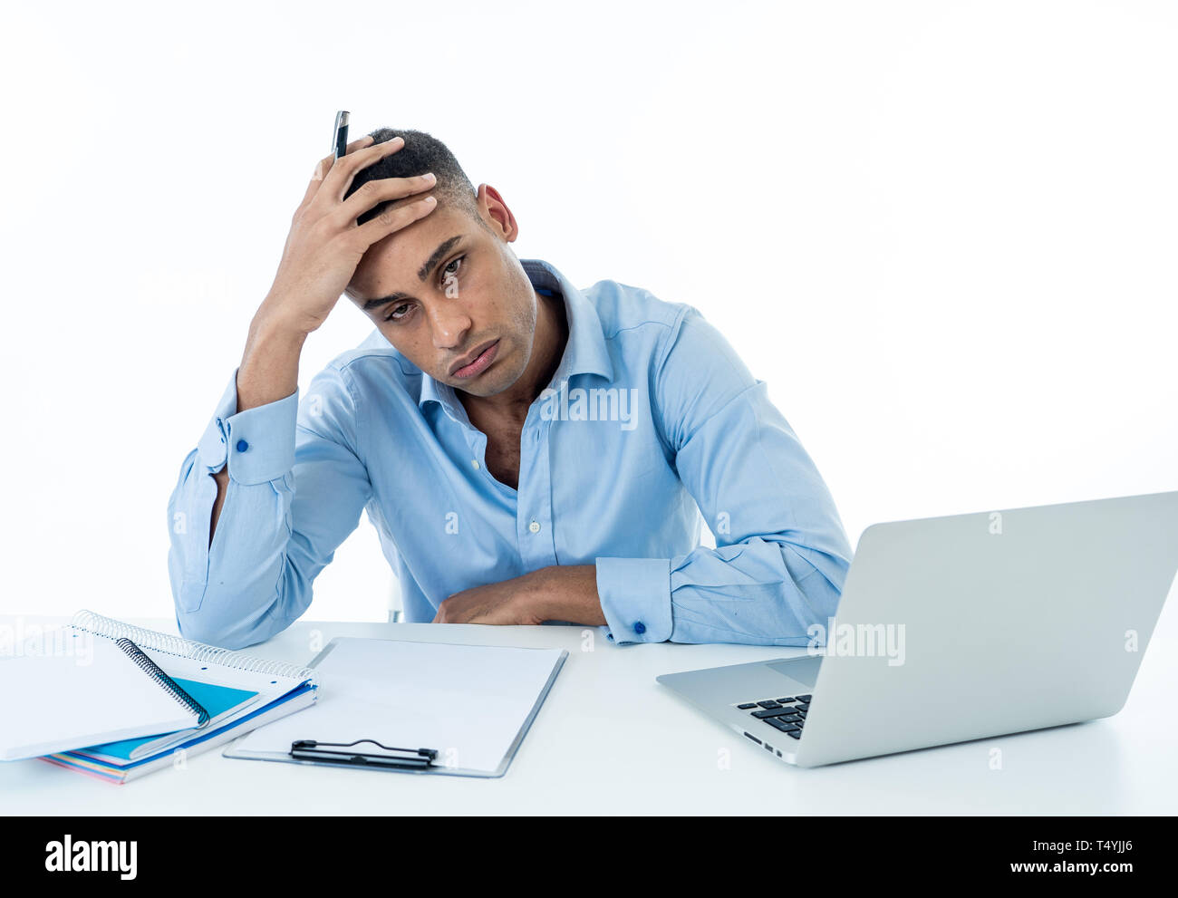 Overwhelmed desperate attractive businessman with too much work feeling frustrated and nervous in distress. Overtime overwork deadline and frustration Stock Photo