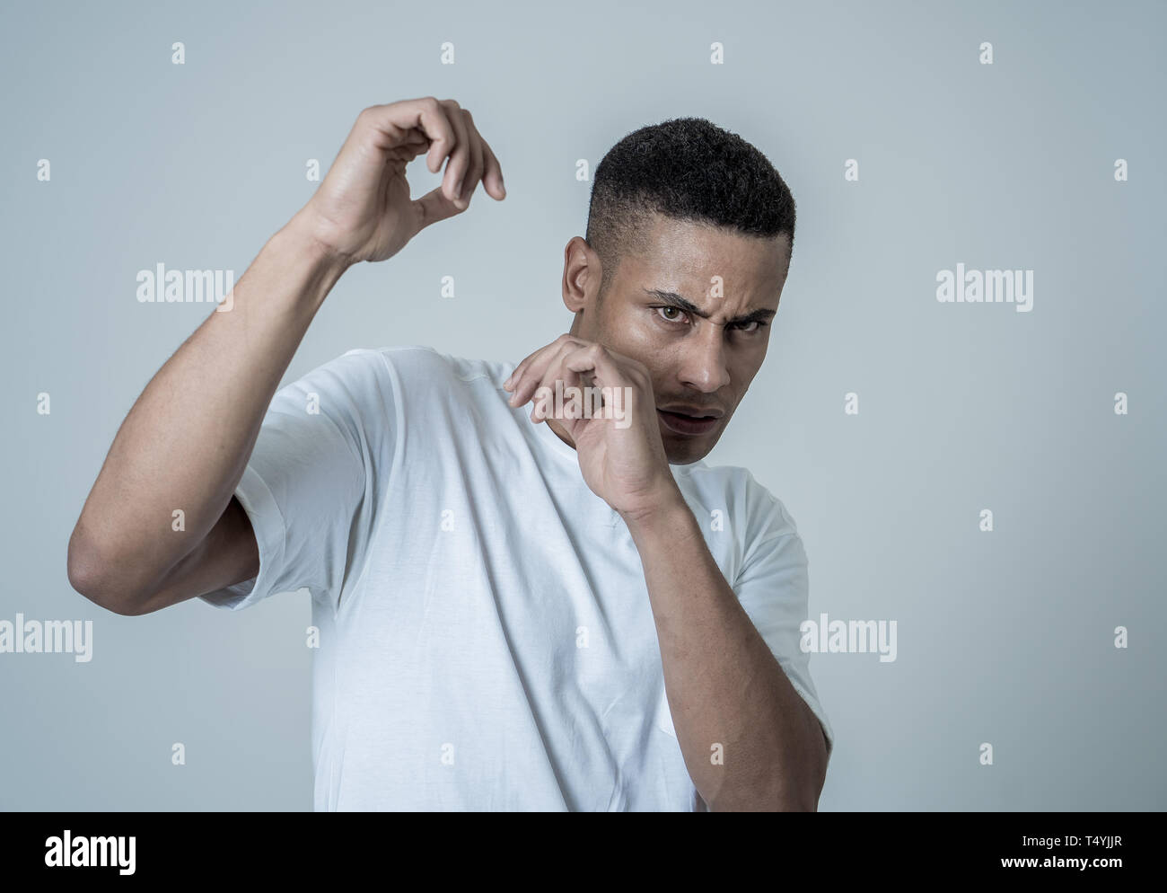 Portrait Of Young Man In Shock With A Scared Face Expression