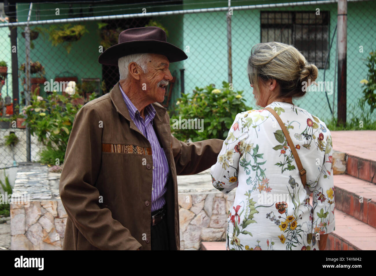 Merida, Venezuela - May 28, 2017: Portrait of an old couple talking to each other in cacute village in the Paramo of Los Andes. Stock Photo