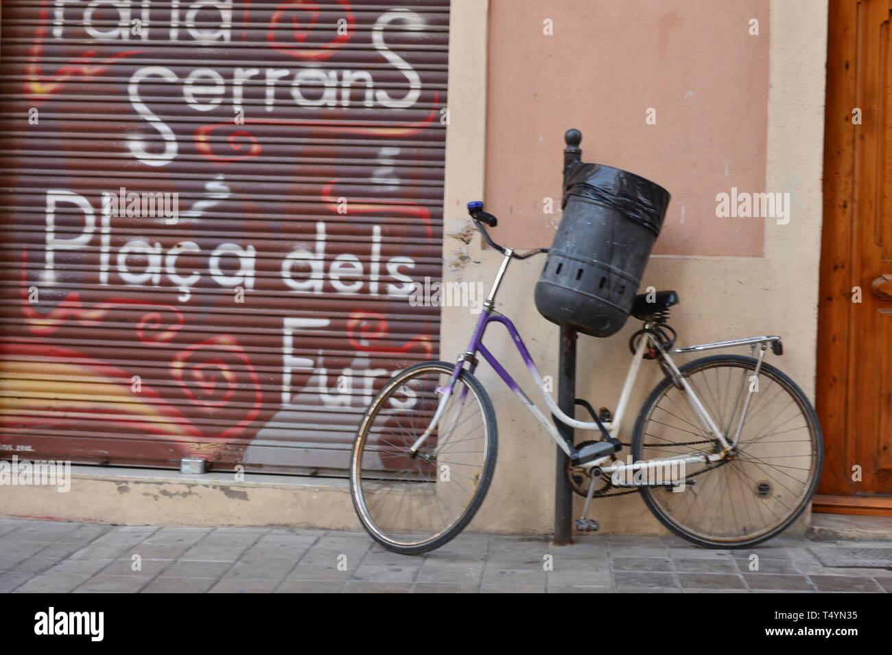 A chain-up bike in the Old Town of Valencia Stock Photo