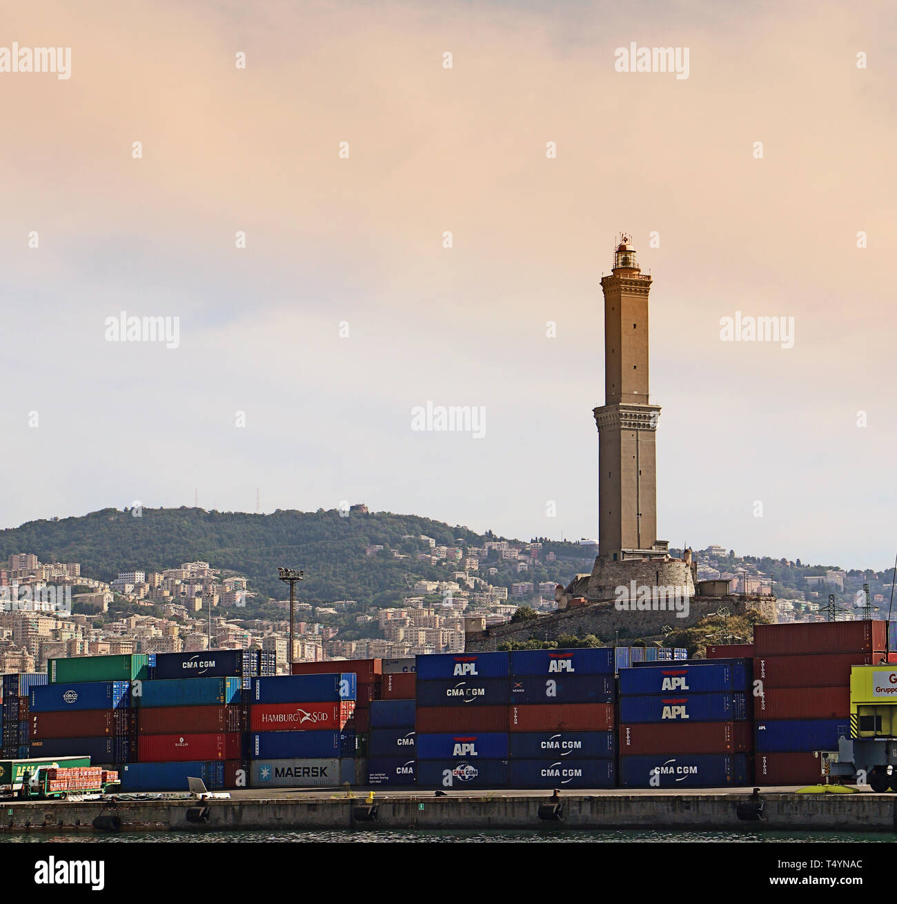 GENOA, ITALY - Genoa harbor with the containerport and the lighthouse called La Lanterna  built around 1128, it is one of the world ol Stock Photo