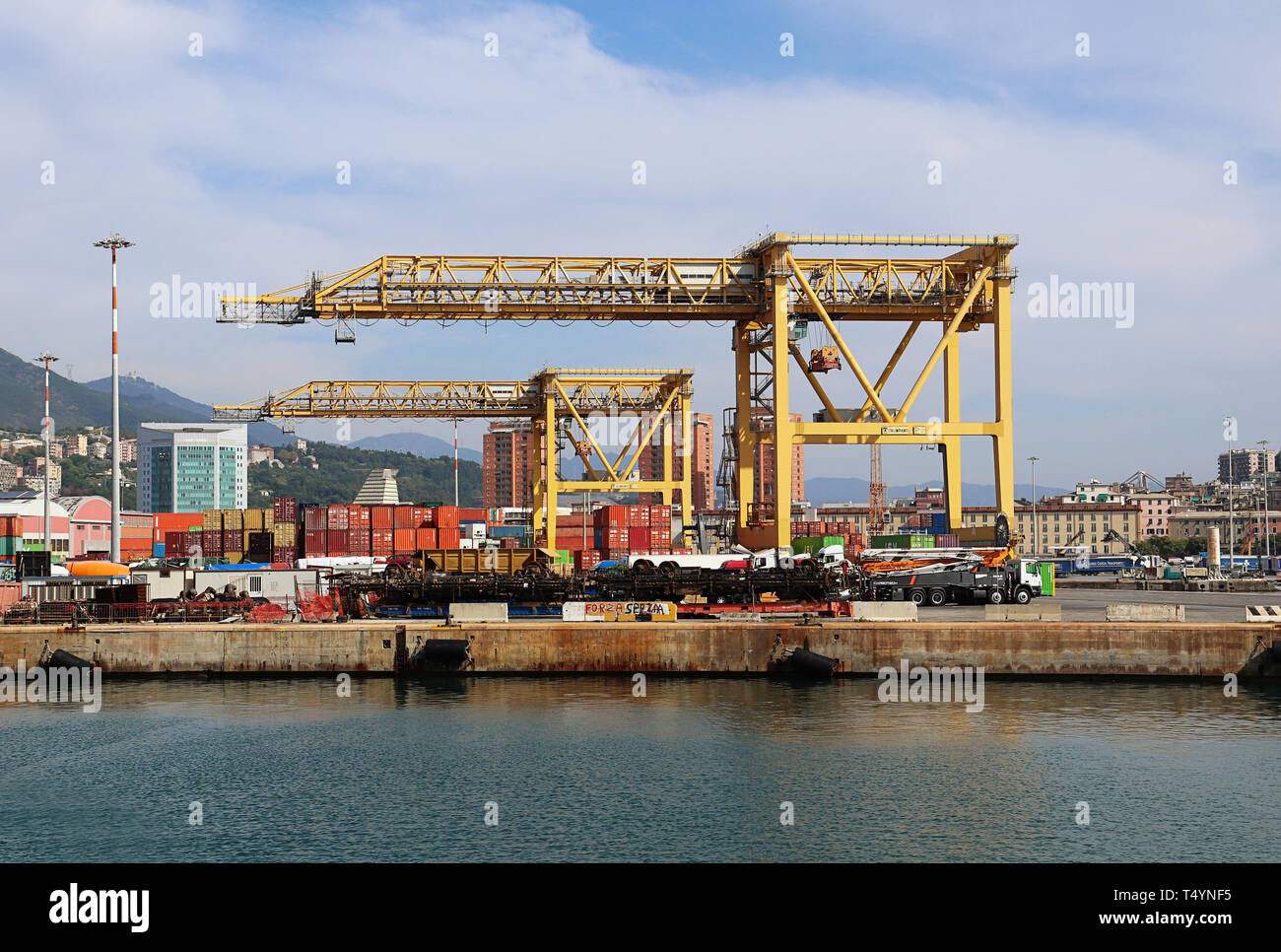 GENOA, ITALY - Cranes and the container terminal of the Genoa harbor Stock Photo