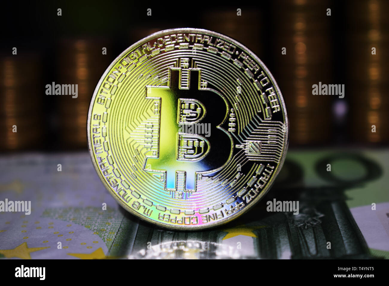 Beautiful Bitcoin BTC on the background of euro banknote and gold coins.  The concept of cryptocurrency Stock Photo - Alamy