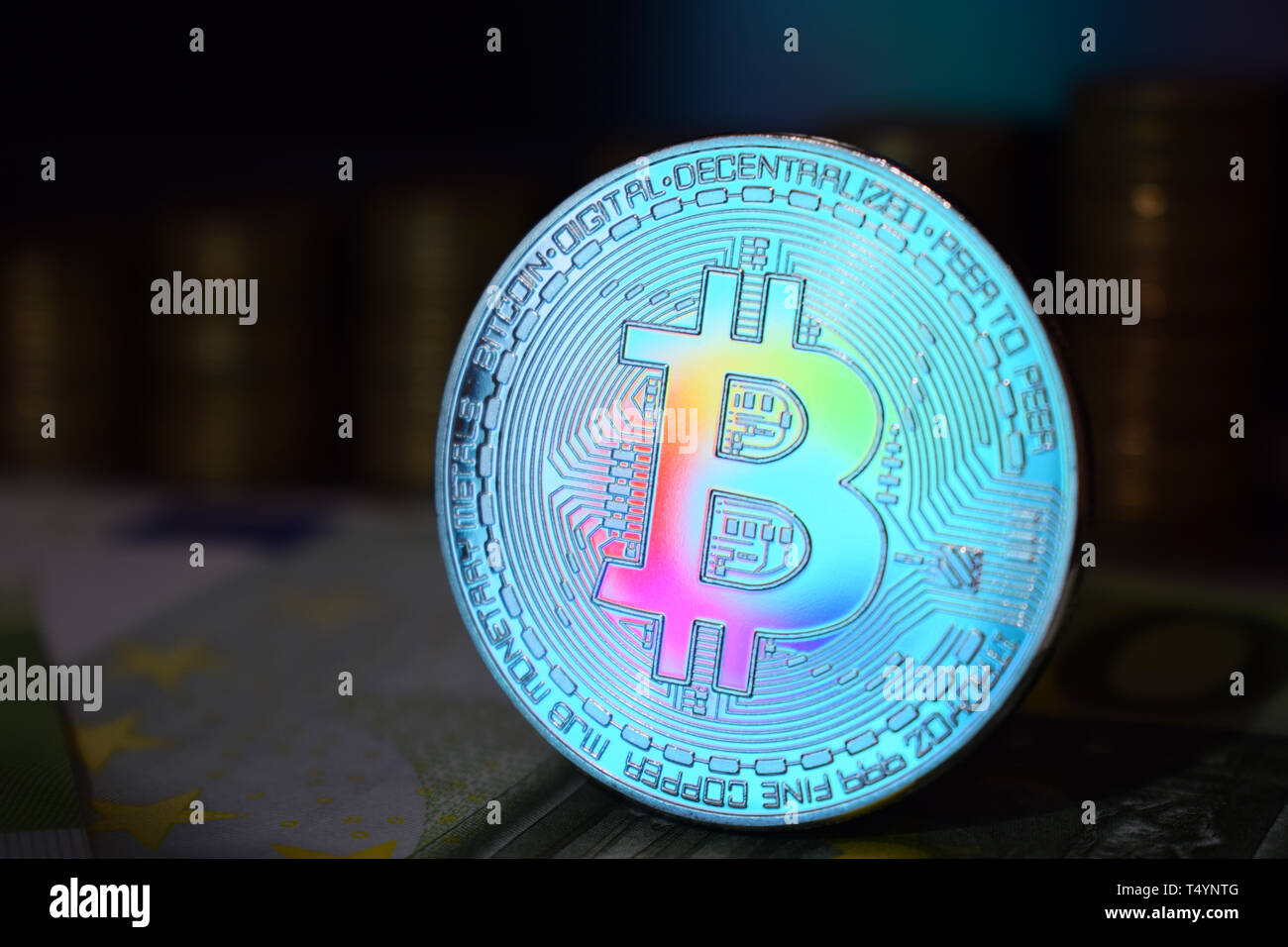 The rainbow physical bitcoin coin is BTC, preferably color blue. The  concept of cryptocurrency Stock Photo - Alamy
