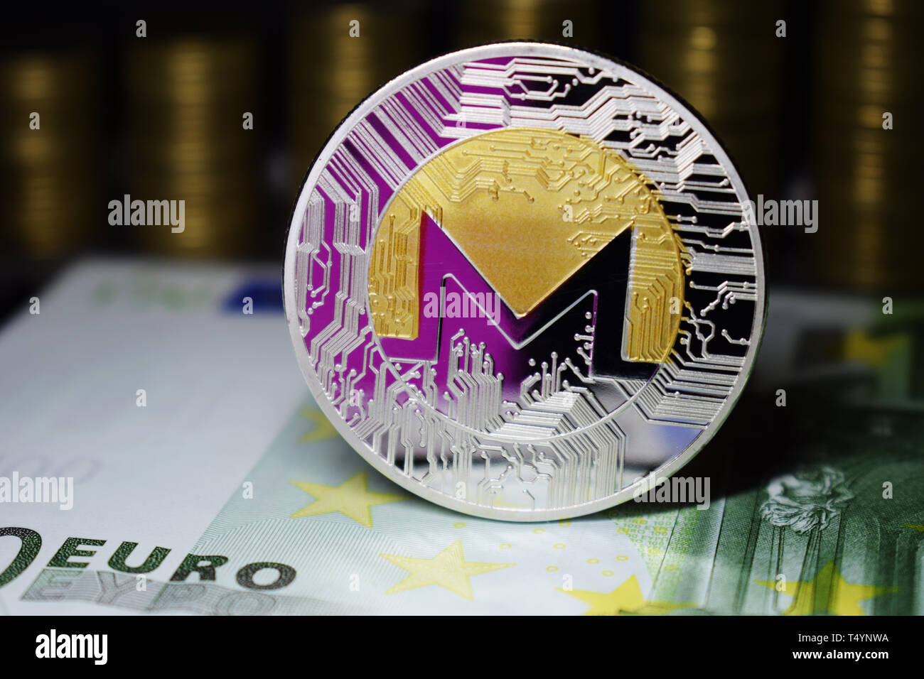 Coin physical Monero XMR with a pink shade. The concept of cryptocurrency  Stock Photo - Alamy