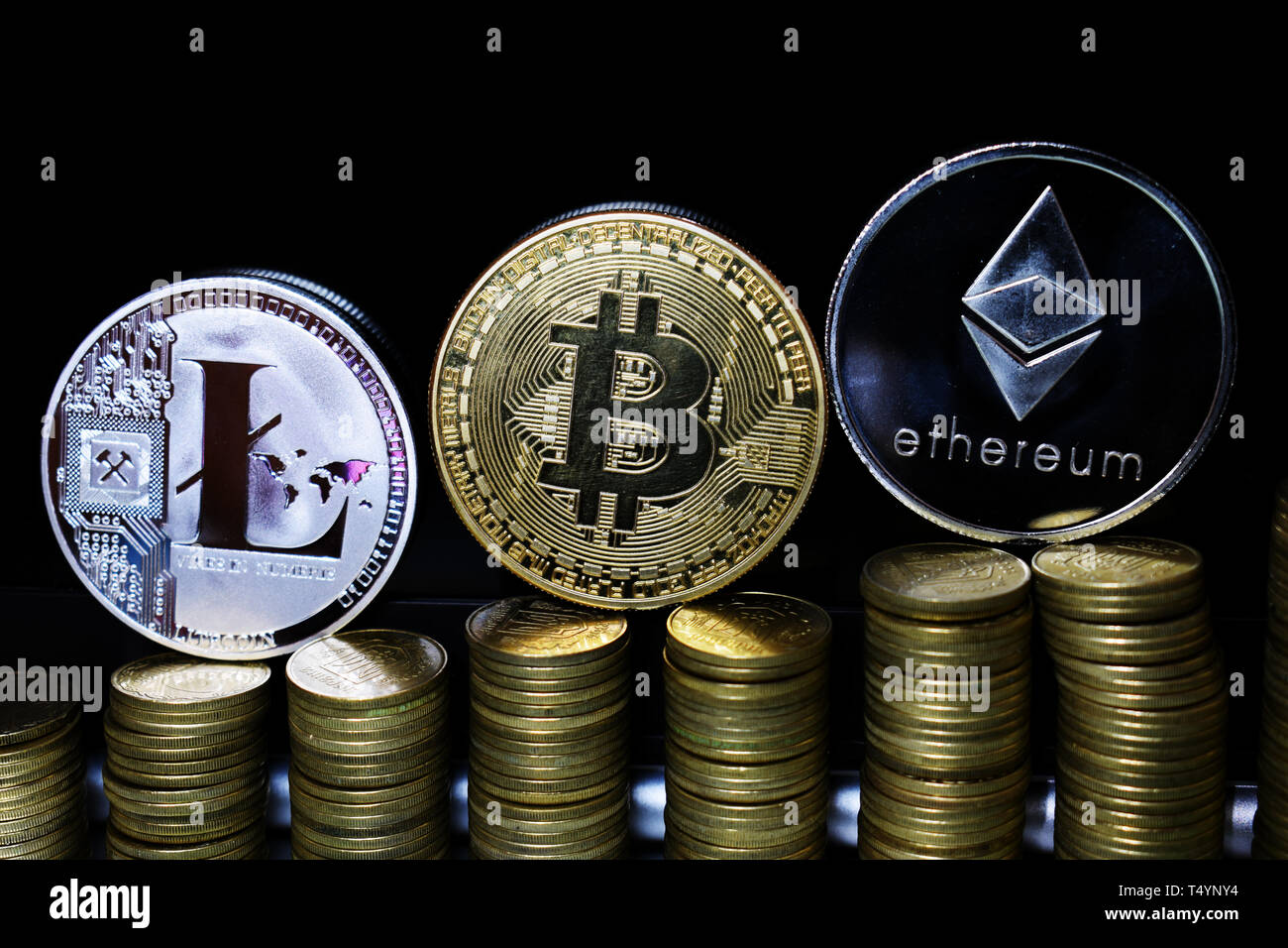 Bitcoin Ethereum and Litecoin on dark background. Gold and Silver shining  Crypto coins. Blockchain technology. Digital commerce and payment systems  Stock Photo - Alamy
