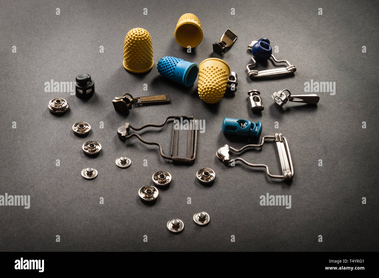 thimble and sewing pins on dark backdround Stock Photo