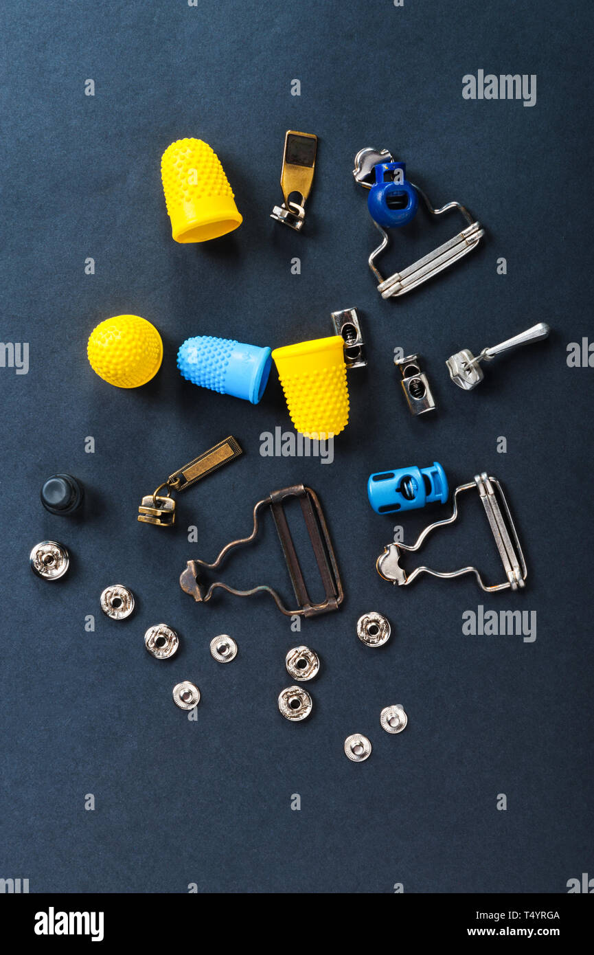 thimble and sewing pins on dark backdround Stock Photo