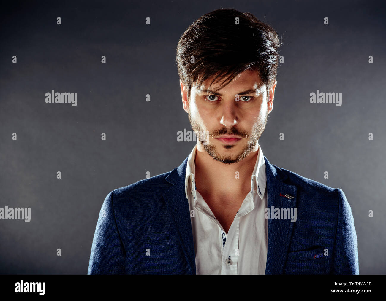 Portrait Of A Fashionable Young Man With Stylish Haircut Wearing
