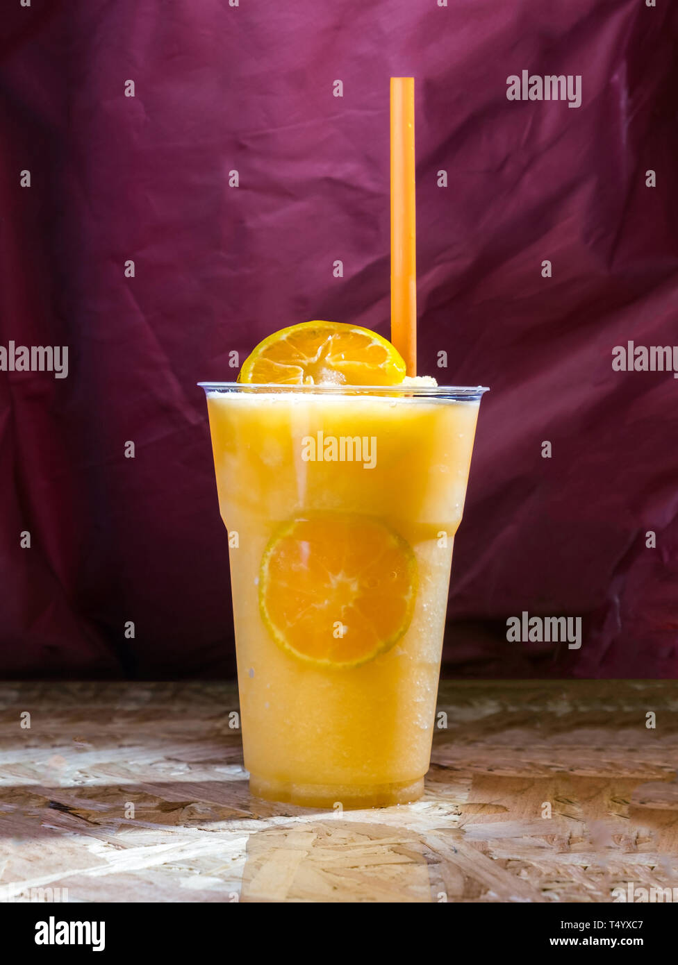 Orange juice frappe tastes fruit sweet and sour in glass on background