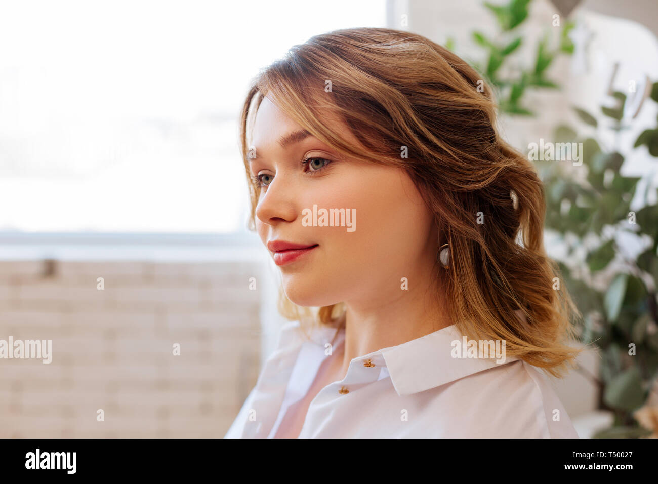 Young woman. Face of a beautiful blonde woman while being in a good mood Stock Photo