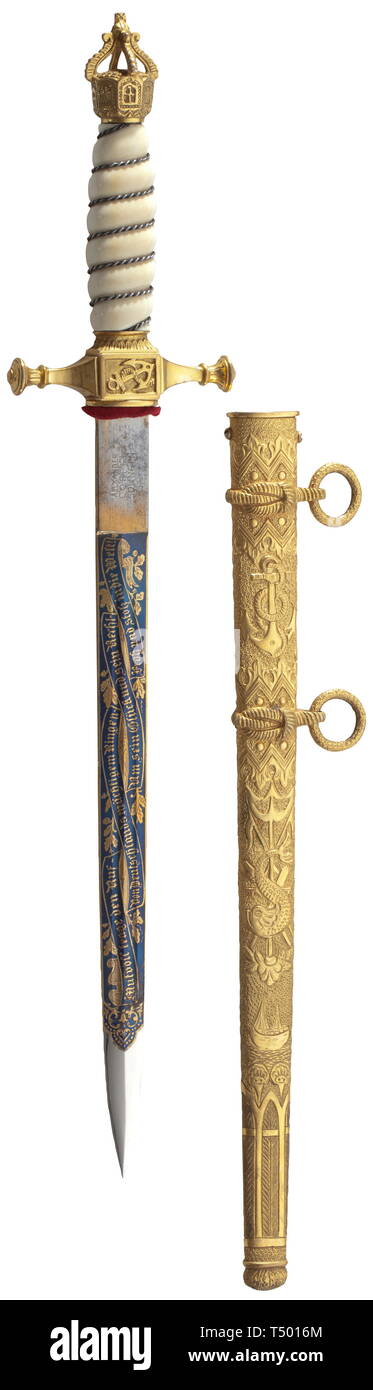 Count Felix von Luckner (1881 - 1966) - an honour dagger of the Luckner Society, Düsseldorf, patterned after the dagger for officers of the Imperial German navy, the blade with double fullers on each side, and etched, blued, and gilded (worn in places). It bears the manufacturer's stamp 'Alexander Coppel, Solingen' and Count von Luckner's family coat of arms framed by naval motifs along with the inscription (tr) 'Bravery Brings Renown - From German 20th century, Editorial-Use-Only Stock Photo