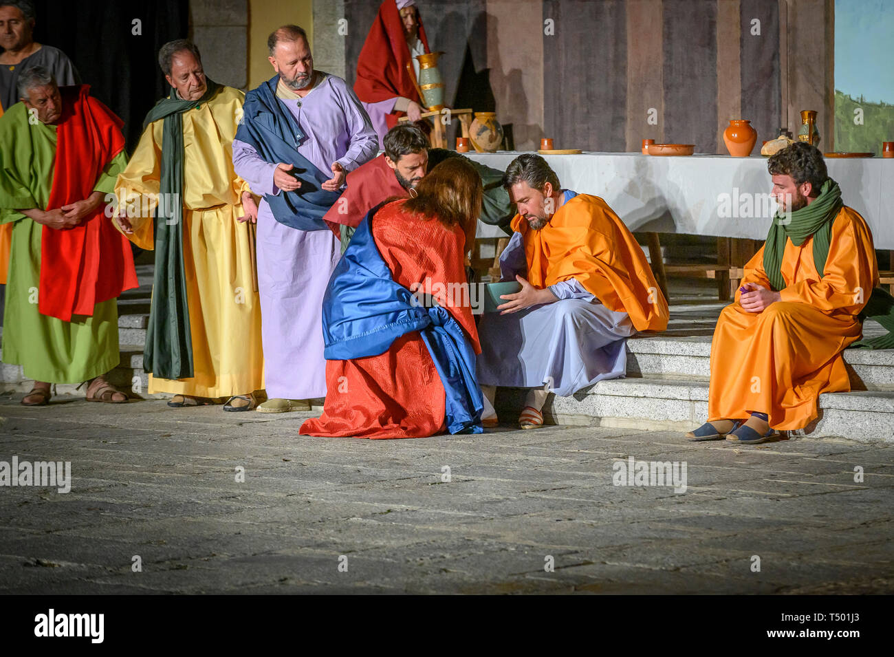 Brunete, Spain - April 11, 2019: Popular play of The Passion of Christ in the Plaza Mayor of the town. Jesus washes the feet of the apostles after the Stock Photo