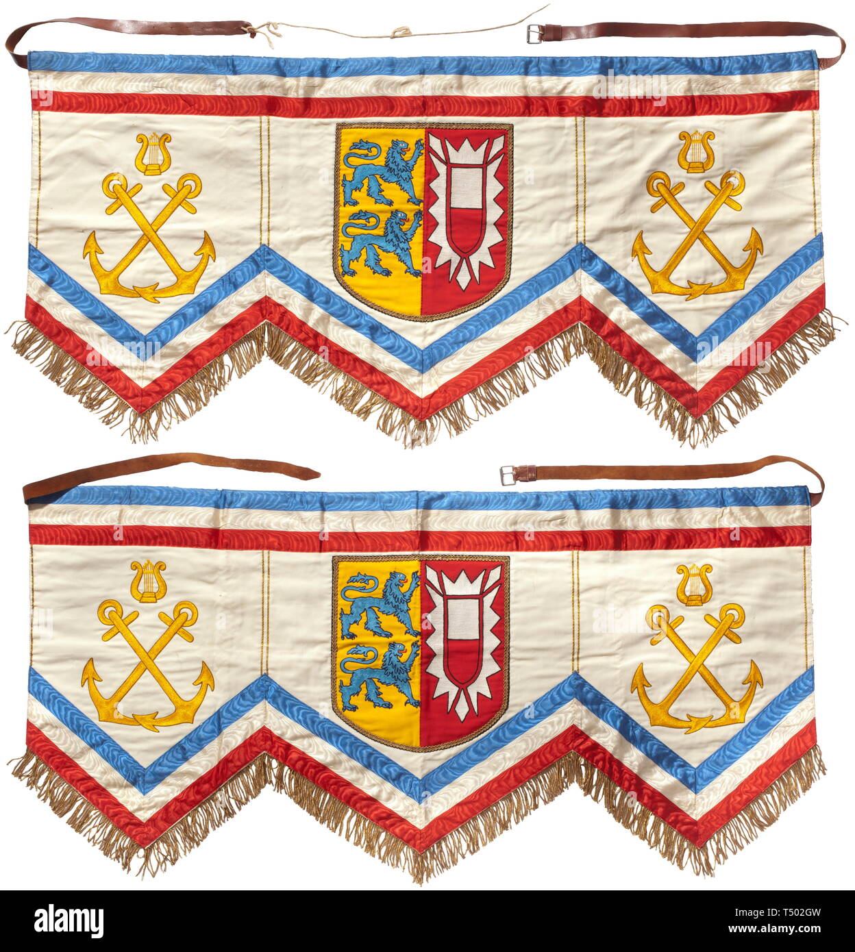 Two kettledrum hangings - line battleship Schleswig-Holstein. Fine cotton cloth rendered in multiple colours with trim in the state colours of Schleswig-Holstein and gold fringe, the fields with crossed anchors with lyres and the coat of arms of the state that gave its name to the ship, leather strapping. The reverse of each labelled with the flag factory tag of 'M. Fleck, Hamburg'. Cloth dimensions ca. 110 x 55 cm. Extremely rare kettledrum hangings. On 1 September 1939 the ship participated in the attack against the fortified Westerplatte position near Danzig. According t, Editorial-Use-Only Stock Photo