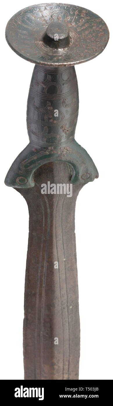 A Central European bronze age sword, circa 1200 BC. Bronze with fine, greenish patina. Leaf-shaped, slightly ridged blade engraved with decorative lines. Riveted grip with finely engraved, geometrical decorations and concave, oval pommel plate. Length 43.5 cm. Provenance: Frankfurt private collection, acquired during the 1970s. historic, historical, prehistory, Additional-Rights-Clearance-Info-Not-Available Stock Photo