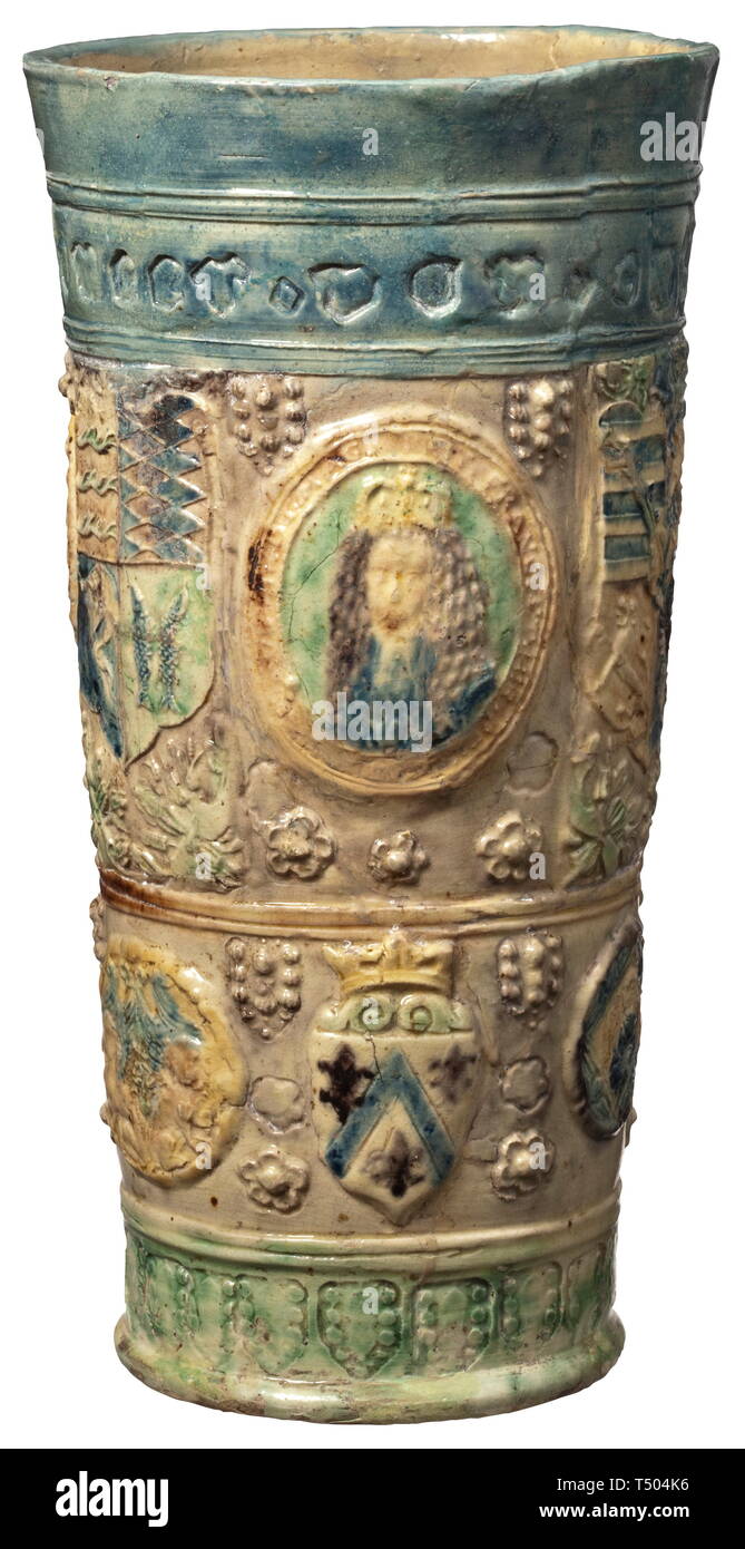 A German beaker with coat of arms, 17th/18th century. Coloured glazed ceramics. The upper rim with minuscule inscription with the name 'juncer(?) von cattenburg' and the year 'mdcxx' (=1620). Thereunder two registers with coats of arms, among others of Saxony, Bavaria and Württemberg as well as a portrait of a prince. Restored condition. Height 24 cm. historic, historical, handicrafts, handcraft, craft, object, objects, stills, clipping, clippings, cut out, cut-out, cut-outs, 17th century, Additional-Rights-Clearance-Info-Not-Available Stock Photo