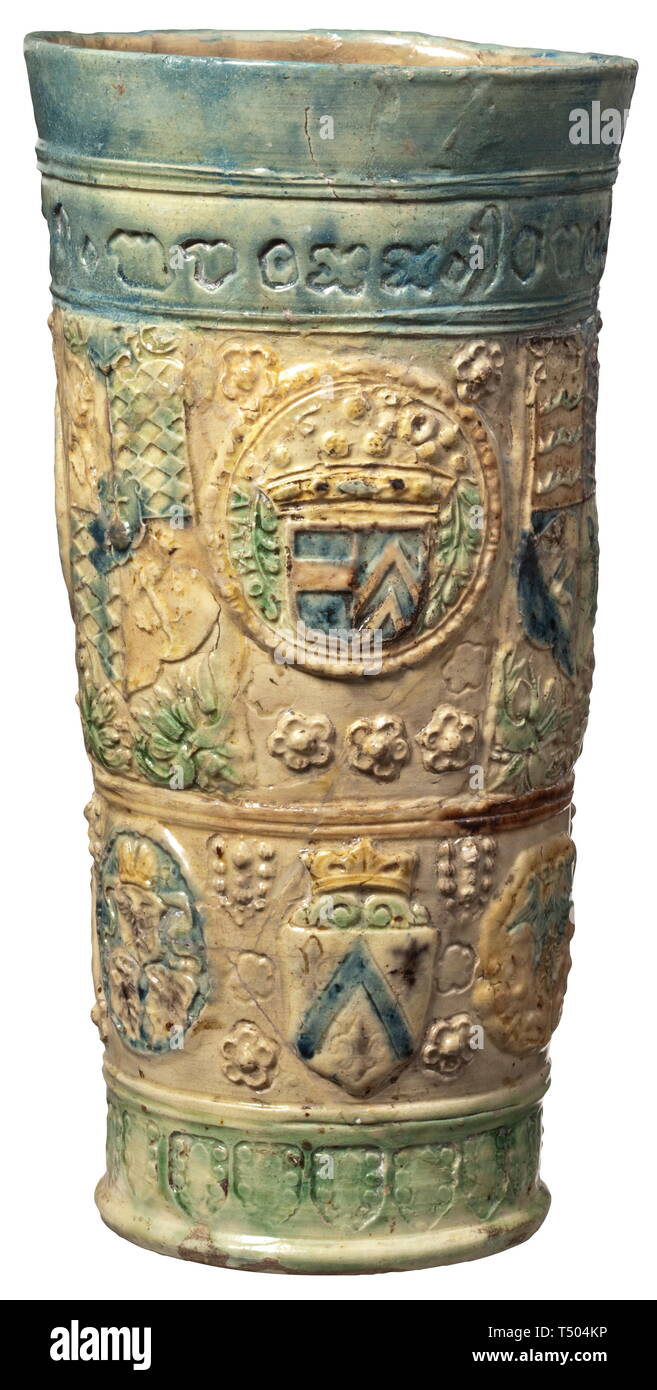 A German beaker with coat of arms, 17th/18th century. Coloured glazed ceramics. The upper rim with minuscule inscription with the name 'juncer(?) von cattenburg' and the year 'mdcxx' (=1620). Thereunder two registers with coats of arms, among others of Saxony, Bavaria and Württemberg as well as a portrait of a prince. Restored condition. Height 24 cm. historic, historical, handicrafts, handcraft, craft, object, objects, stills, clipping, clippings, cut out, cut-out, cut-outs, 17th century, Additional-Rights-Clearance-Info-Not-Available Stock Photo