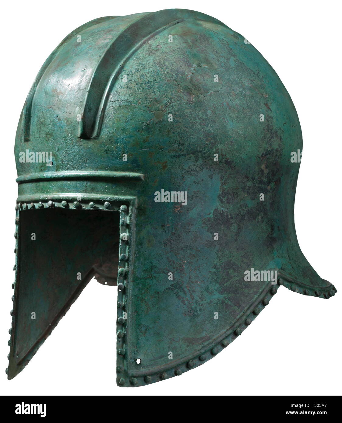 An Illyrian helmet, 6th century BC. Bronze with light green patina. Tall, large skull with two raised parallel ridges for the crest and attachment holes at front and back. Large face-opening surmounted by a narrow rib across the brow. Long pierced cheek-pieces and beautifully flared neck-guard. A row of lenticular decorative pins around the perimeter. Replacements and restorations at the crown and around the edges. Height 24 cm, weight 857 g. Provenance: German private collection, 1970s. historic, historical, ancient world, ancient times, Greek, , Additional-Rights-Clearance-Info-Not-Available Stock Photo