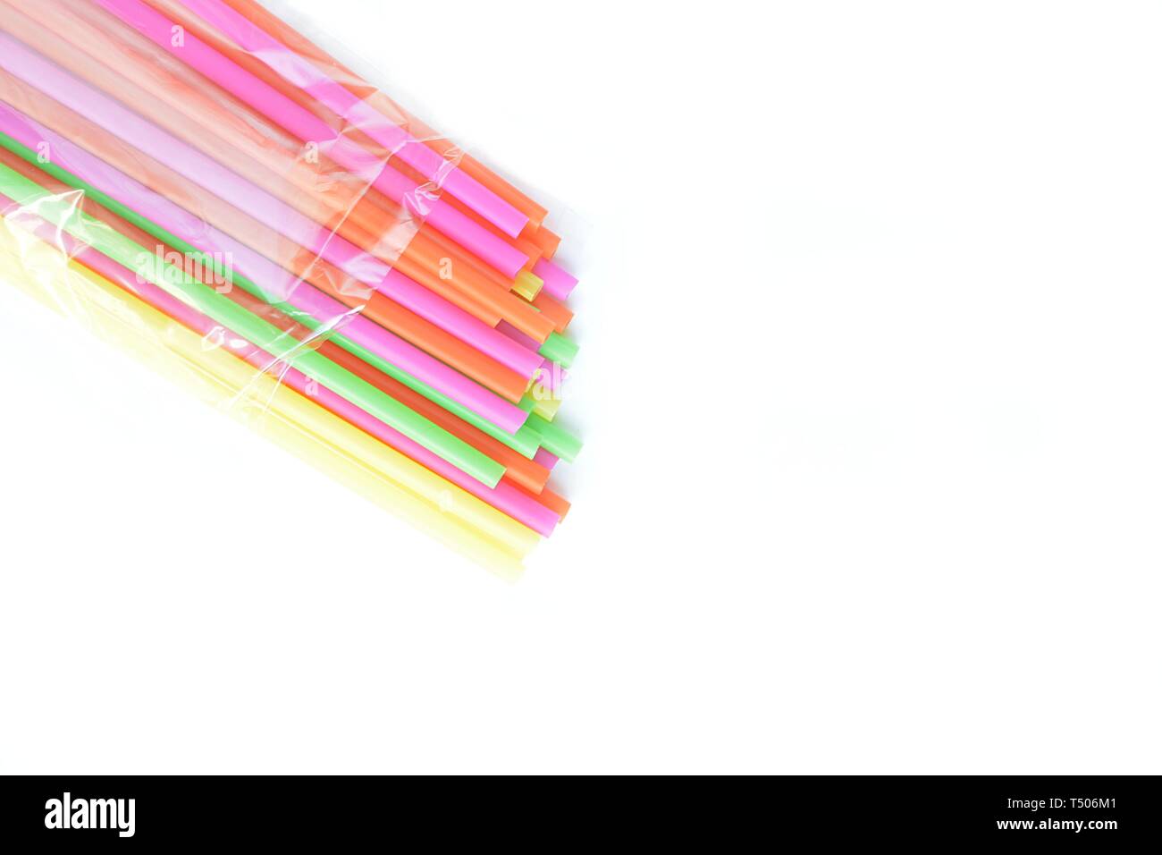colored plastic drinking straws on a white background Stock Photo