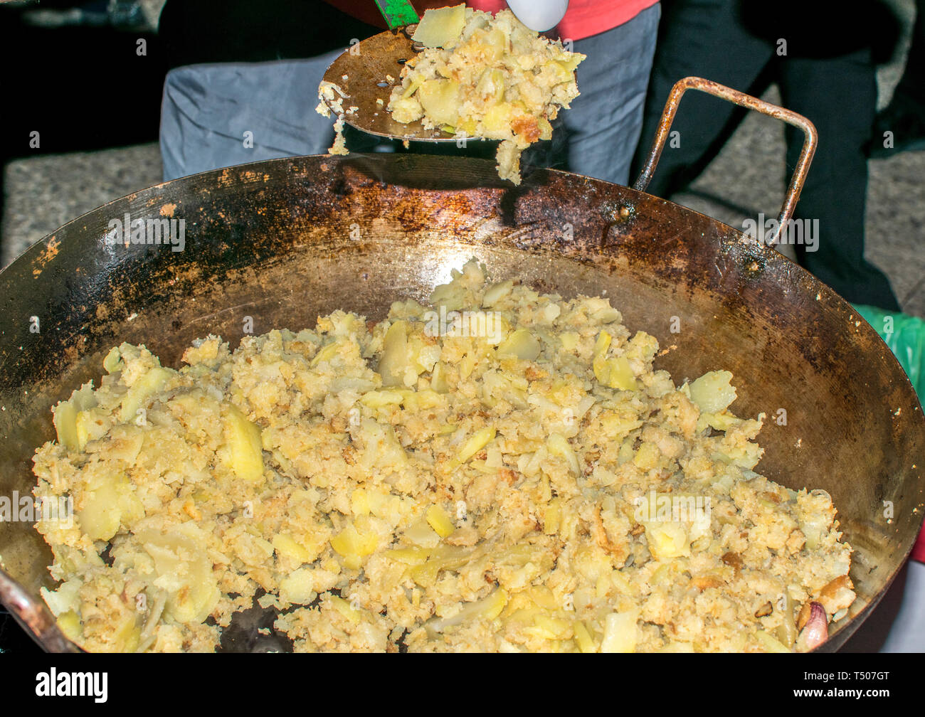 Cooking migas or Crumbs, a typical spanish food. Crumbs prepared in a