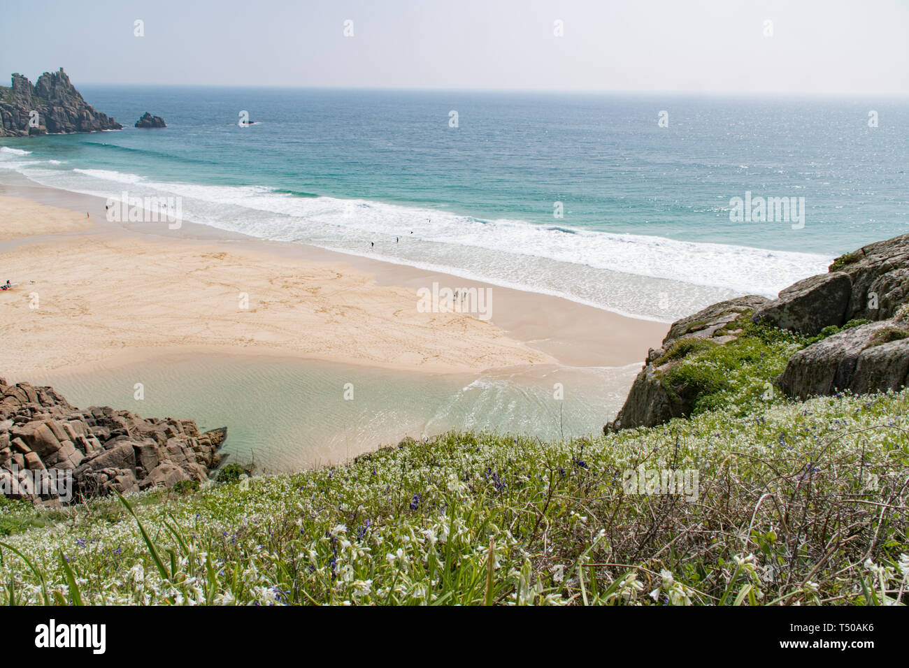 Treen, Cornwall, UK. 19th April 2019. UK Weather: The beaches at Treen and Porthcurno were looking like the carribean on Easter Friday. It was hot. and locals and holiday makers were making the most of the turquoise sea. Stock Photo