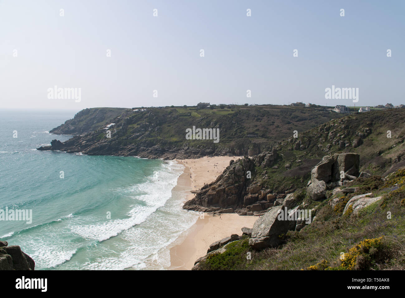 Treen, Cornwall, UK. 19th April 2019. UK Weather: The beaches at Treen and Porthcurno were looking like the carribean on Easter Friday. It was hot. and locals and holiday makers were making the most of the turquoise sea. Stock Photo