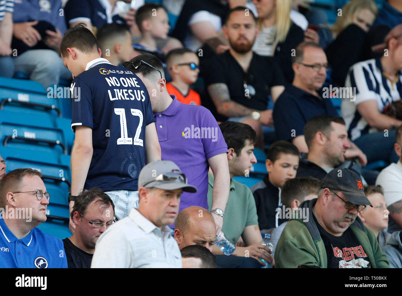 London, UK. 19th Apr, 2019. A Millwall fan with the popular slogan 'no-one likes us' on the back of their shirt during the EFL Sky Bet Championship match between Millwall and Brentford at The Den, London, England on 19 April 2019. Photo by Carlton Myrie. Editorial use only, license required for commercial use. No use in betting, games or a single club/league/player publications. Credit: UK Sports Pics Ltd/Alamy Live News Stock Photo