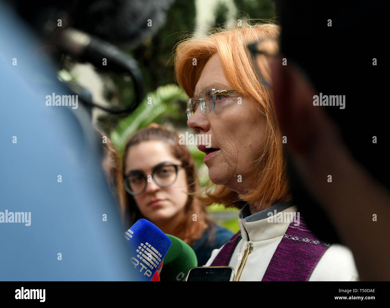 19 April 2019, Portugal, Funchal (Madeira): Ilse Everlien Berardo (r), pastor from Germany, gives an interview at the funeral service for the German victims of the bus accident in front of the Presbyterian Church in Madeira. In the bus accident on 17.04.2019 on the Portuguese Atlantic island Madeira 29 people lost their lives. A coach with dozens of German tourists had left the road early Wednesday evening in the town of Canico, had overturned and had fallen down a slope onto a house. Photo: Andriy Petryna/dpa Stock Photo