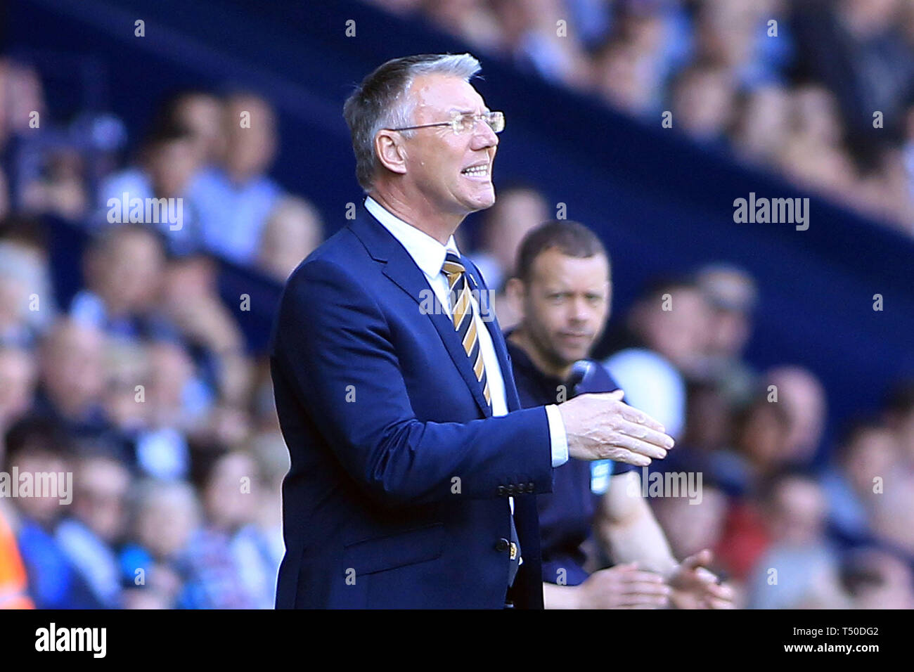 West Bromwich, UK. 19th Apr, 2019. Hull City Manager Nigel Adkins shouts instructions from the touch line. EFL Skybet championship match, West Bromwich Albion v Hull City at the Hawthorns in West Bromwich on Friday 19th April 2019. this image may only be used for Editorial purposes. Editorial use only, license required for commercial use. No use in betting, games or a single club/league/player publications. pic by Steffan Bowen/Andrew Orchard sports photography/Alamy Live news Credit: Andrew Orchard sports photography/Alamy Live News Stock Photo
