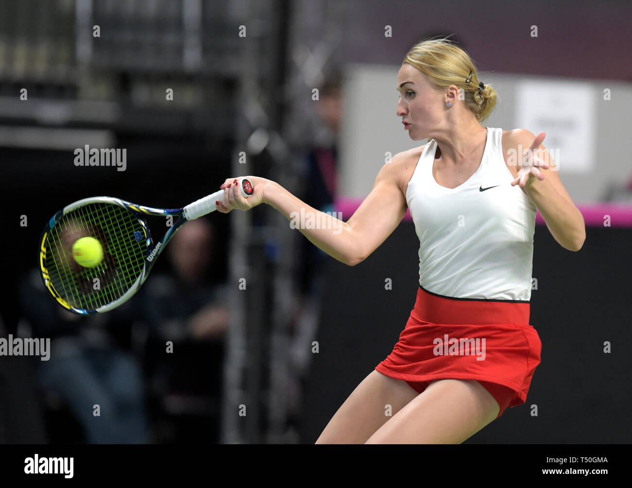 Riga. 19th Apr, 2019. Diana Marcinkevica of Latvia returns a shot to Julia  Goerges of Germany during the 2019 Fed Cup World Group Play-offs between  Latvia and Germany in Riga, Latvia on