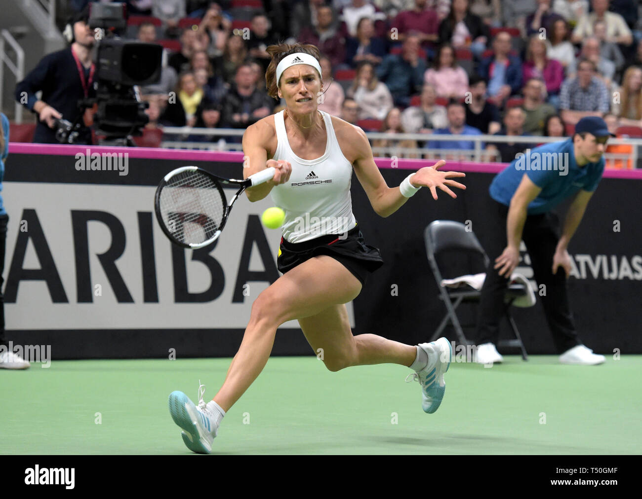 Riga. 19th Apr, 2019. Andrea Petkovic of Germany returns a shot to Jelena Ostapenko of Latvia during the 2019 Fed Cup World Group Play-offs between Latvia and Germany in Riga, Latvia on April 19, 2019. Credit: Edijs Palens/Xinhua/Alamy Live News Stock Photo