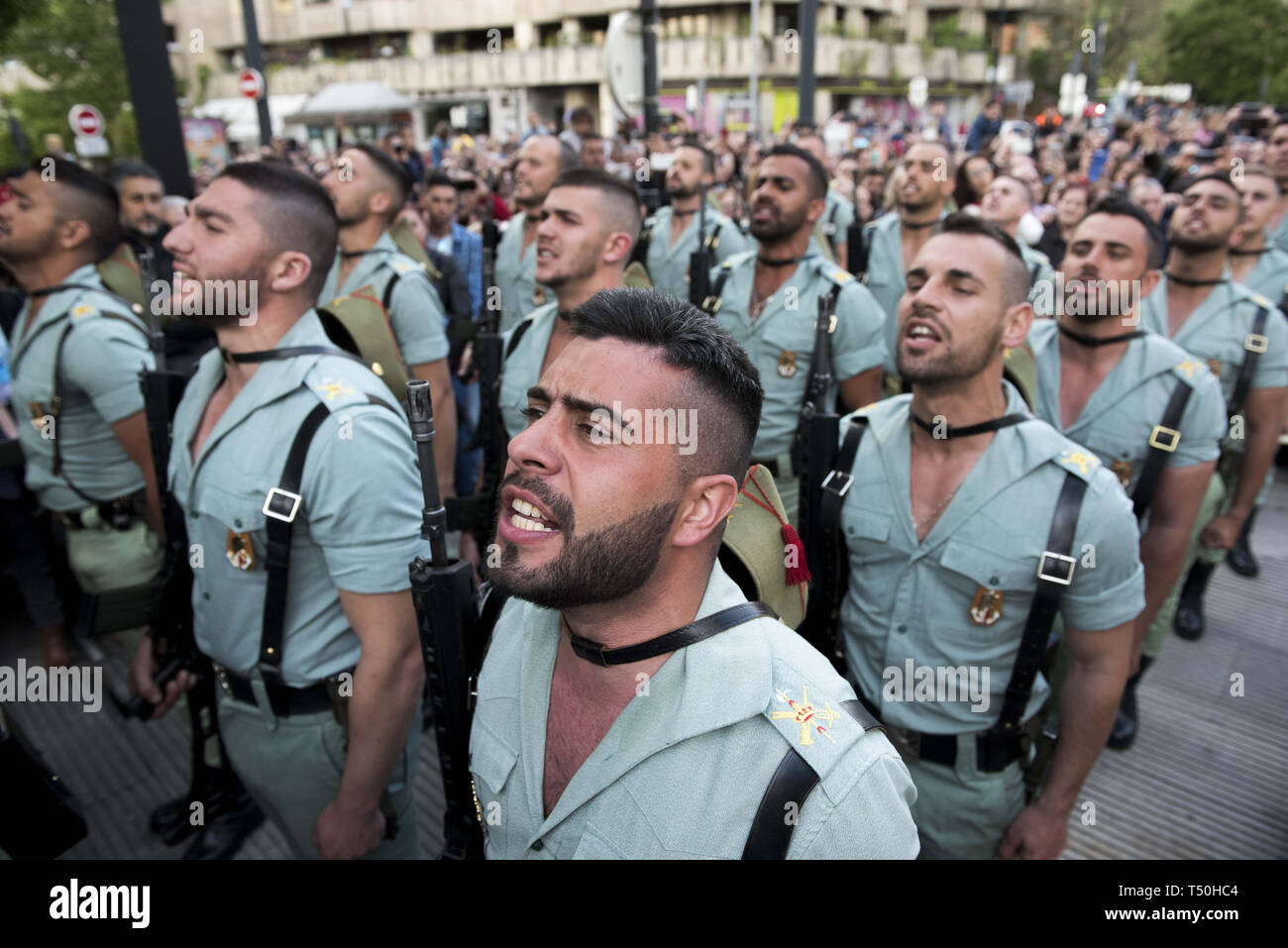 Granada, Spain. 19th Apr, 2019. Soldiers of ''La legion'' are seen singing during the Good Friday procession in Granada.Every year thousands of christians believers celebrates the Holy Week of Easter with the crucifixion and resurrection of Jesus Christ. Credit: Carlos Gil/SOPA Images/ZUMA Wire/Alamy Live News Stock Photo