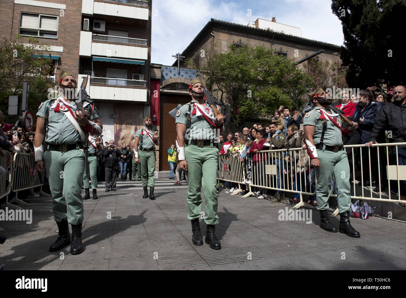Granada, Spain. 19th Apr, 2019. Soldiers of ''La Legion'' are seen during the Good Friday procession in Granada.Every year thousands of christians believers celebrates the Holy Week of Easter with the crucifixion and resurrection of Jesus Christ. Credit: Carlos Gil/SOPA Images/ZUMA Wire/Alamy Live News Stock Photo