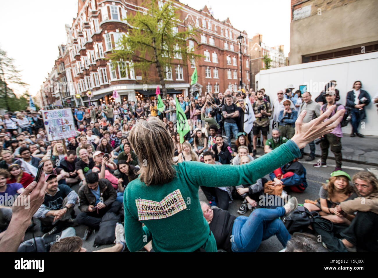 London, UK. 19th Apr, 2019. Gail Bradbrook (back) speaking to the protesters blocking the passage of the truck that was carrying the boat ''Berta Caceres'', close to the BBC headquarters during the Extinction Rebellion Strike in London.An operation of hundreds of policeman was mobilized to remove the pink boat from Oxford Circus. Extinction Rebellion have blocked five central London landmarks for fifth day in protest against government inaction on climate change. Credit: Brais G. Rouco/SOPA Images/ZUMA Wire/Alamy Live News Stock Photo