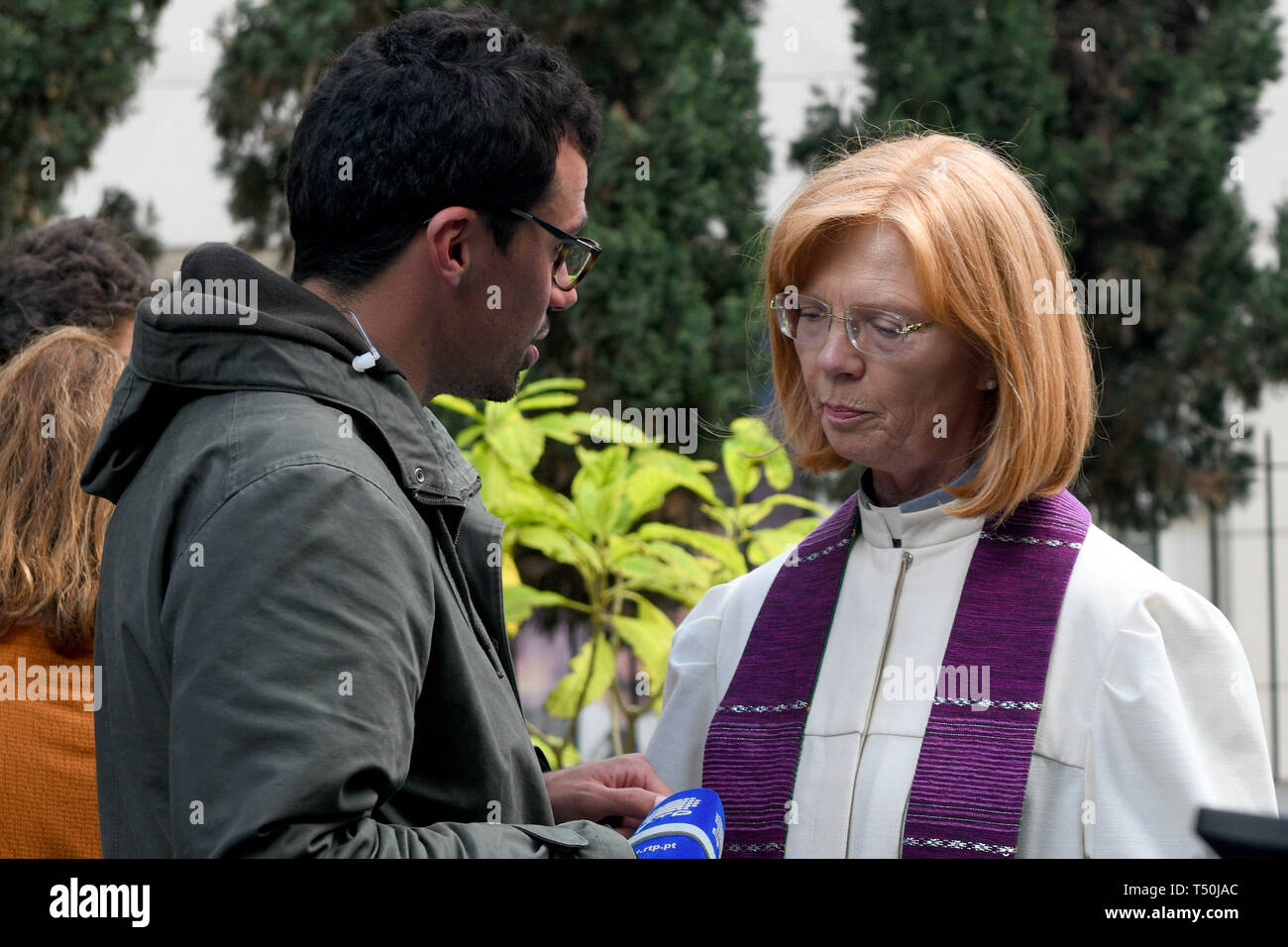 19 April 2019, Portugal, Funchal (Madeira): Ilse Everlien Berardo (r), pastor from Germany, gives an interview at the funeral service for the German victims of the bus accident in front of the Presbyterian Church. In the bus accident on 17.04.2019 on the Portuguese Atlantic island Madeira 29 people lost their lives. A coach with dozens of German tourists had left the road early Wednesday evening in the town of Canico, had overturned and had fallen down a slope onto a house. Photo: Andriy Petryna/dpa Stock Photo