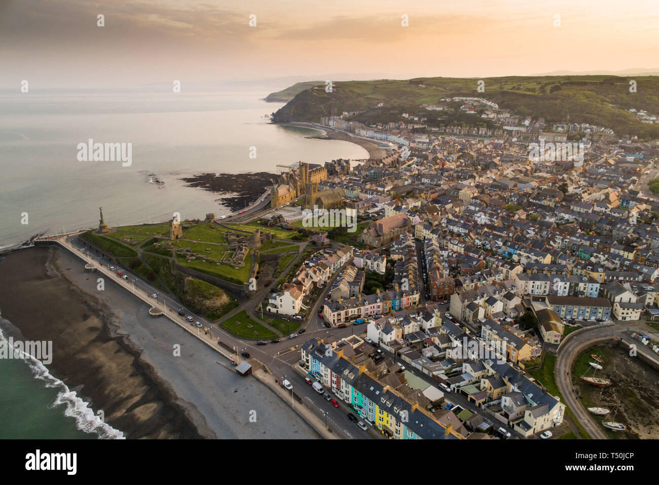 Aberystwyth Wales UK, Easter Saturday, 20 April 2019. UK Weather: Daybreak over the seaside and university town of Aberystwyth on the west wales coast, at the start of Easter Saturday 2019. The weather is again set to be hot and sunny, with temperatures in the low 20's Celsius (low 70's Fahrenheit). Aerial image by CAA approved and licenced drone operator photo Credit: Keith Morris/Alamy Live News Stock Photo