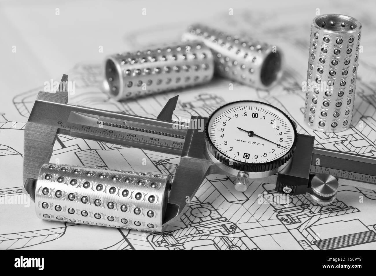 Caliper. Linear ball bearings. Plan. Measuring of metal rollers. Technical drawing. Metallic gauge with vernier scale and round dial. Steel part group. Stock Photo