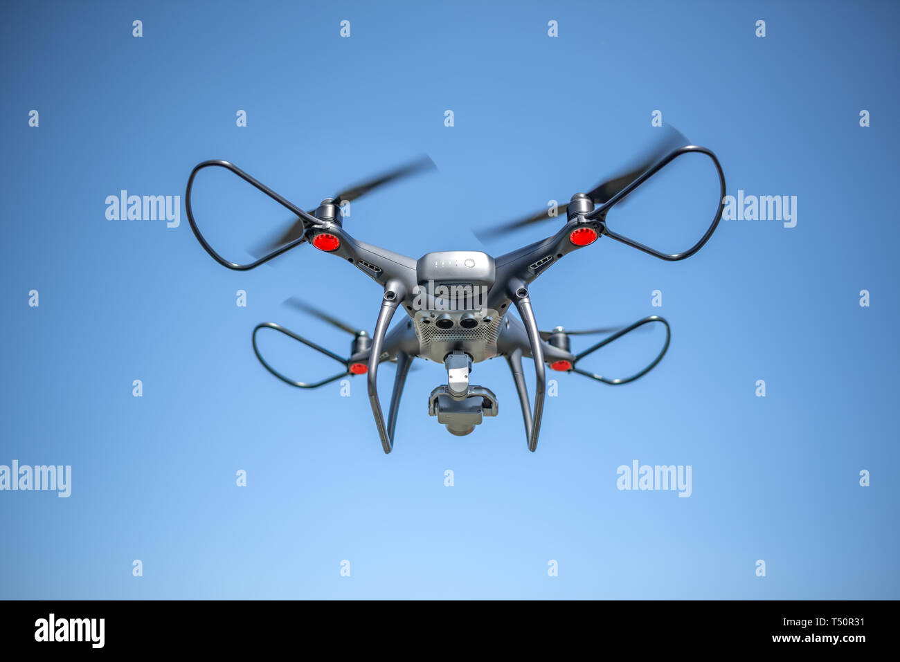 Drone in the sky. Unmanned aerial vehicle flying in the air Stock Photo ...