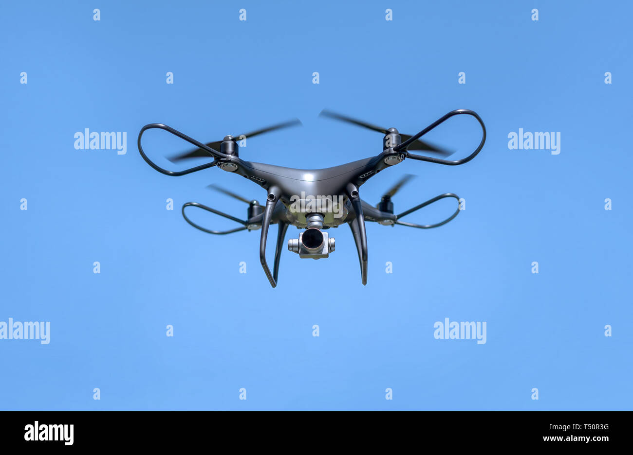 Drone in the sky. Unmanned aerial vehicle flying in the air Stock Photo ...