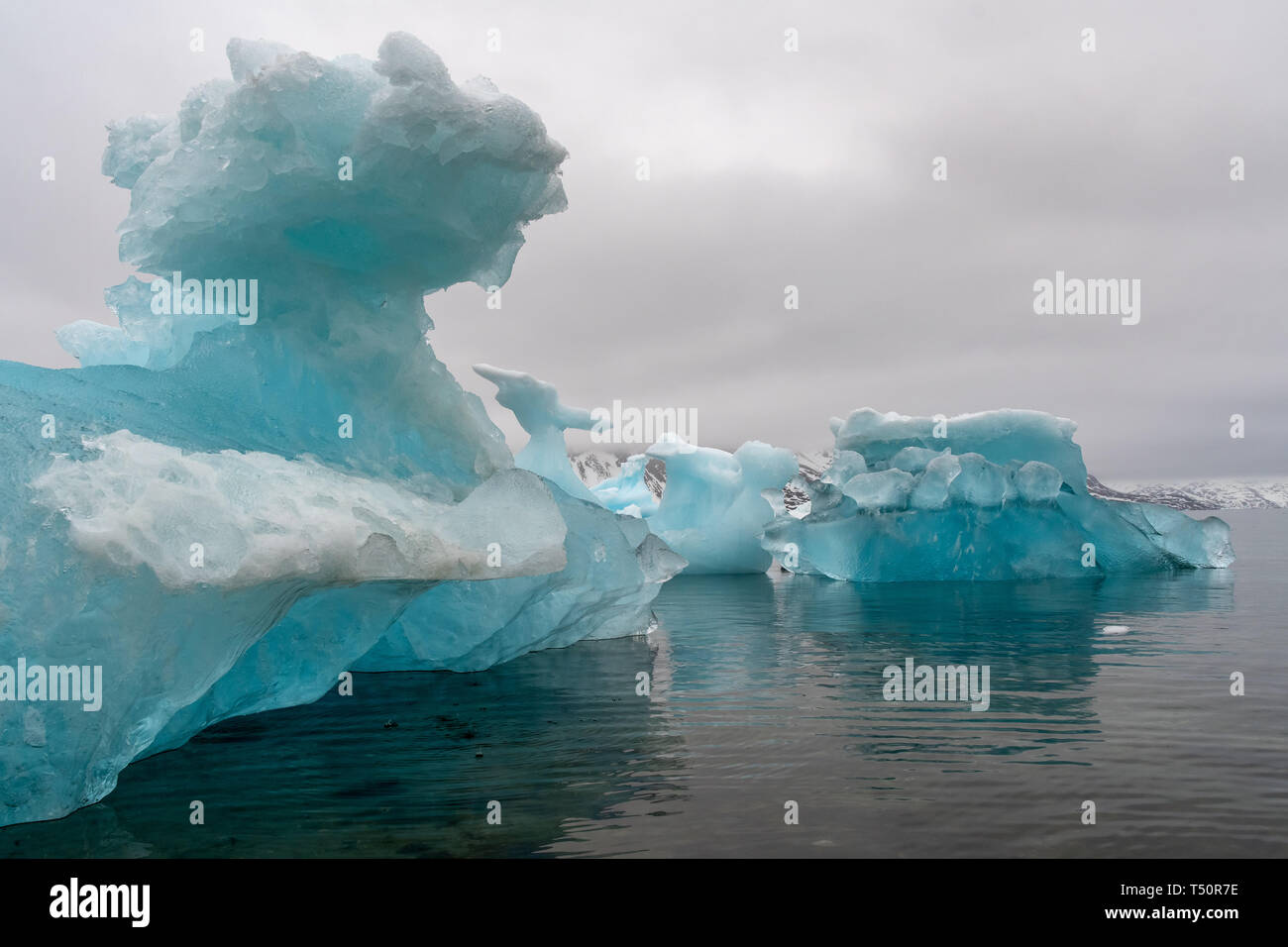 Ice formation carved by wind and rain in the coastal waters of western Greenland Stock Photo