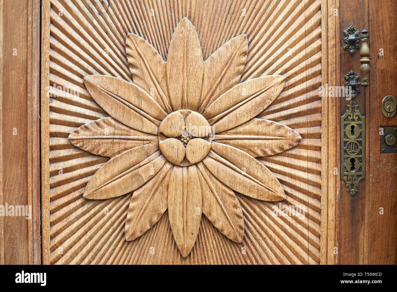 Carved flower on wooden door texture background Stock Photo