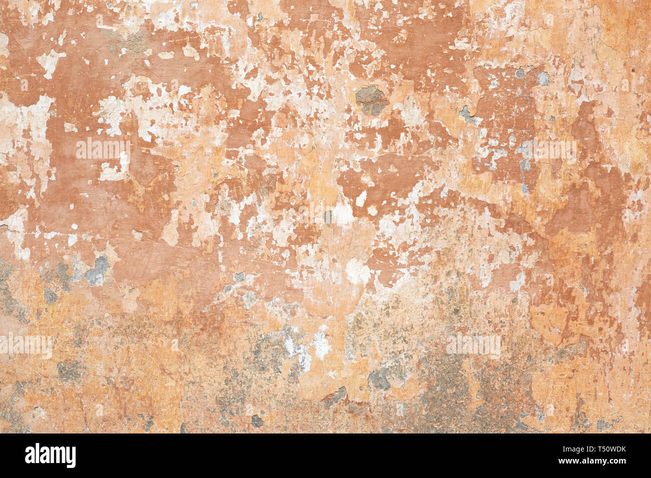Old beige chipped wall texture background in Italy Stock Photo