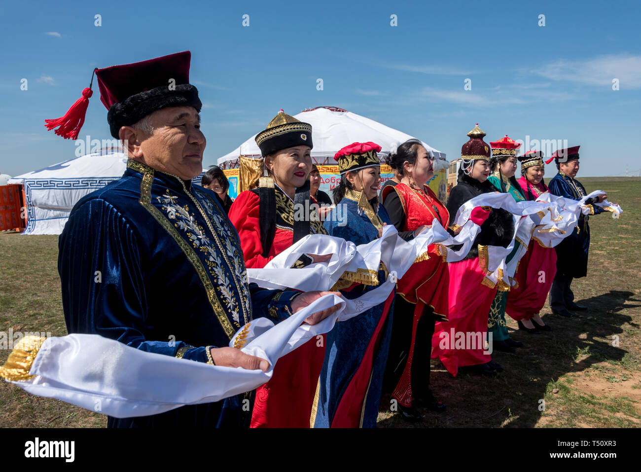 Kalmyk meeting ceremony and Kalmyk national ethnic dance in the steppe, Kalmykia, Russia Stock Photo