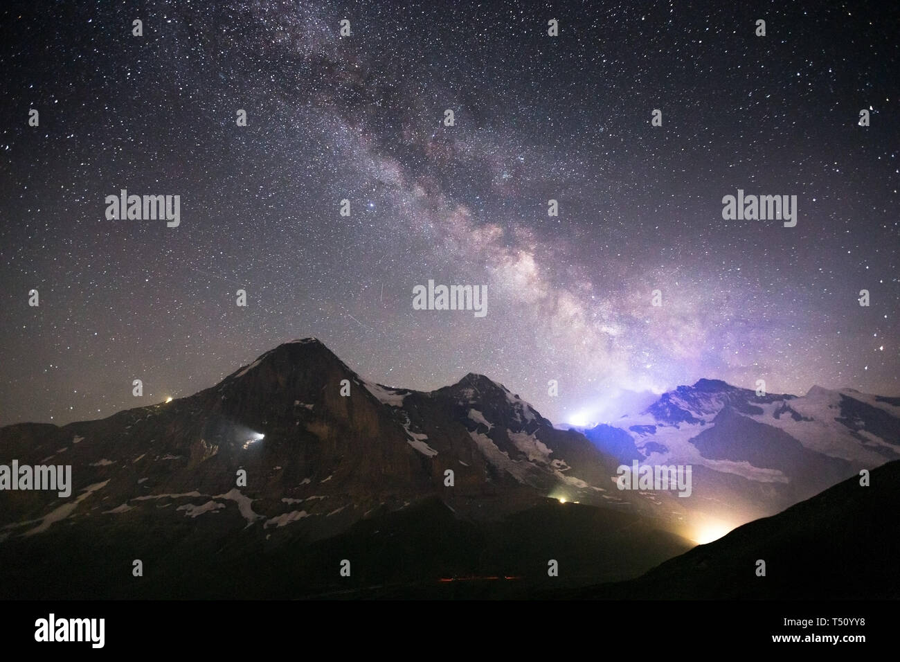 Milky Way, starry sky, night landscape. Eiger, Monch, Jungfrau mountains. Bernese Alps. Swiss Alps. Europe. Stock Photo