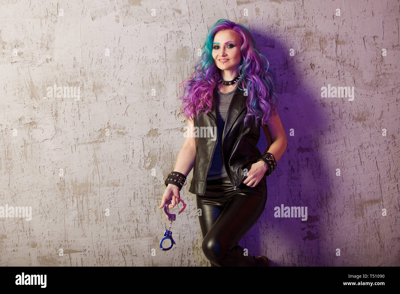 Daring Rebel Rocker In Black Leather Clothes With Colored Hair
