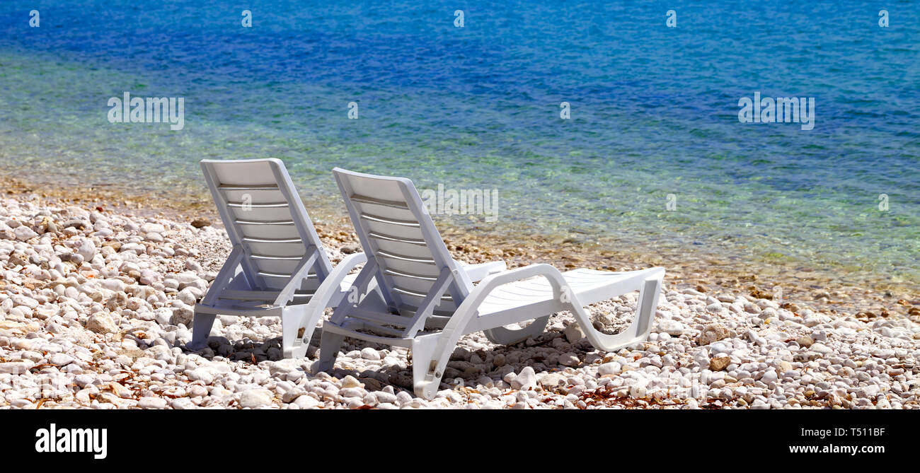 Deck chairs on beach hi-res stock photography and images - Alamy